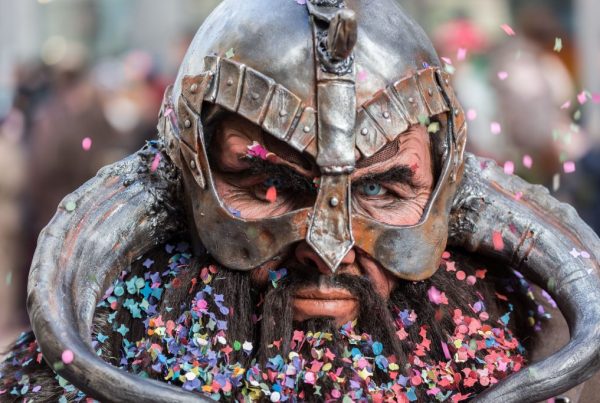 bearded man with vikinger outfit and confetti falling on him