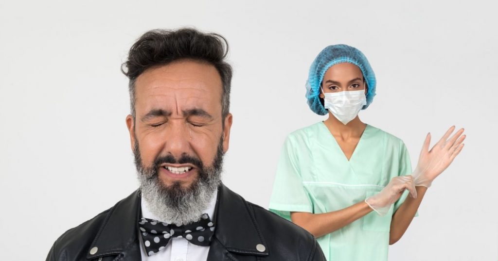 bearded man crying and doctor with gloves behind him