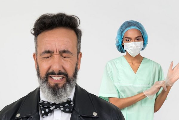 bearded man crying and doctor with gloves behind him
